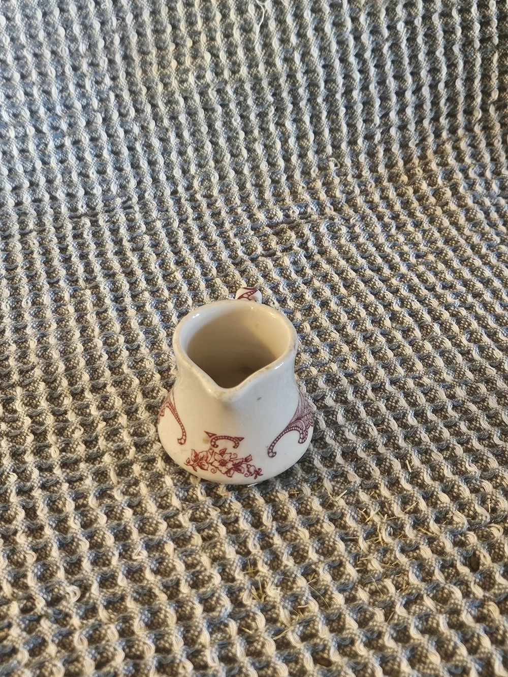 Cream Ceramic Mini Pitcher with Red Filigree Accent